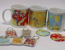 Mugs and keyrings decorated with art created by SEND students